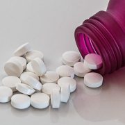 Pills scattered from a pink bottle. What you need to know about Benzo Detox at Home