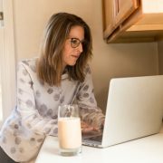 woman working from her computer while doing suboxone detox at home